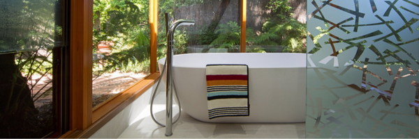 A bathtub with a towel on itAI-generated content may be incorrect.